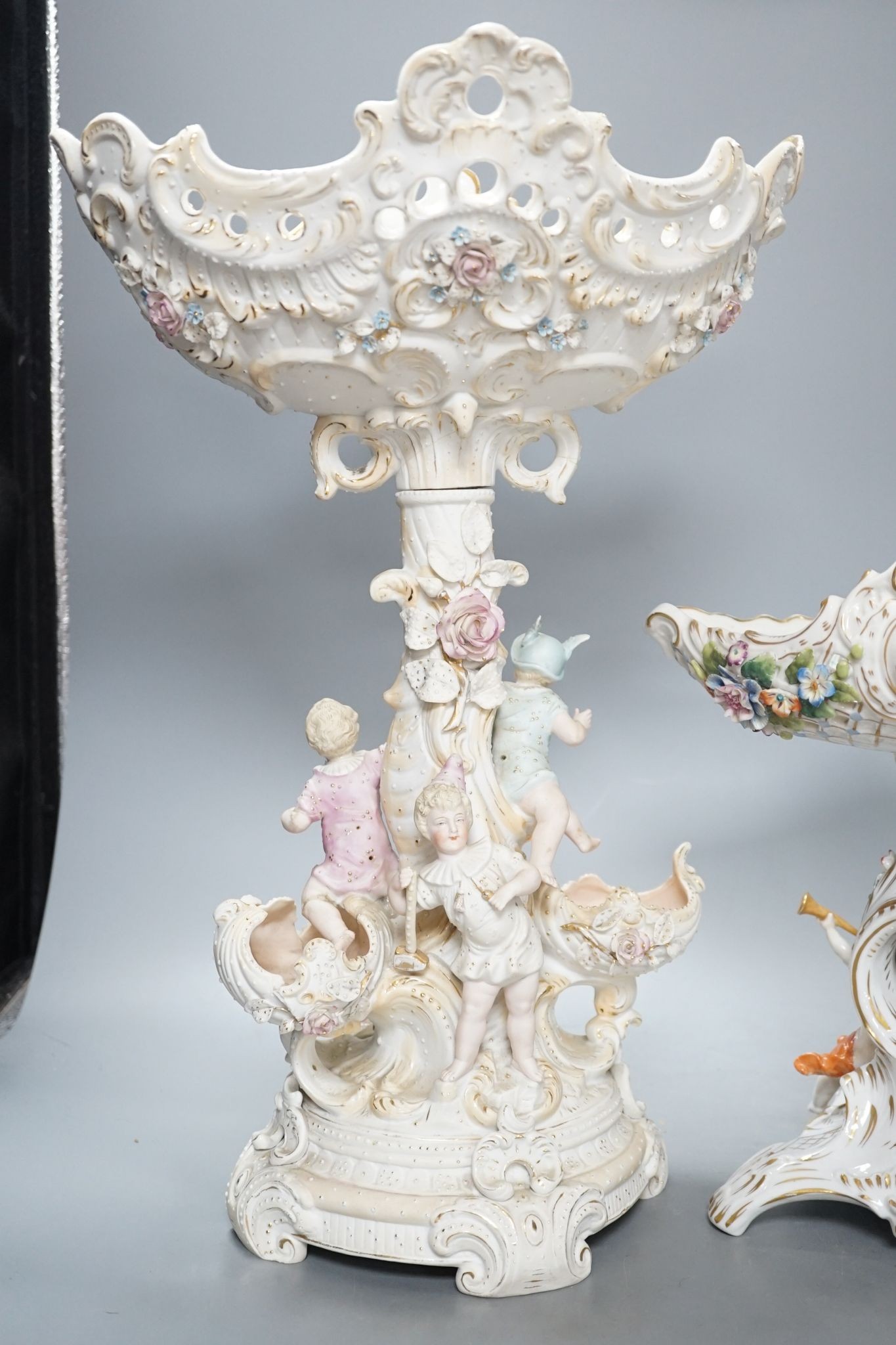 A French bisque centrepiece, Naples porcelain centrepiece and figural chariot, tallest 44cm